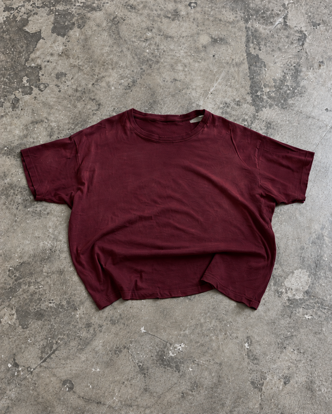 California Tee in Oxblood, laid flat on concrete